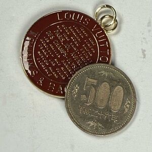 Louis Vuitton Carmel brown and Gold Coin Pendant two-sided pendent. Coin not